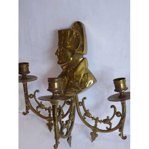 55 - Two late 19th/early 20th century three-light brass wall appliques; each headed with shoulder length ... 
