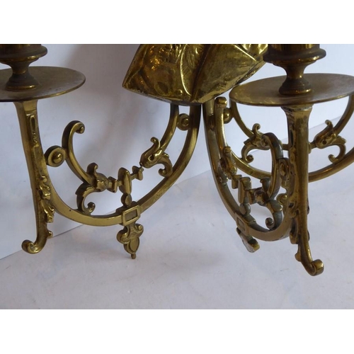 55 - Two late 19th/early 20th century three-light brass wall appliques; each headed with shoulder length ... 