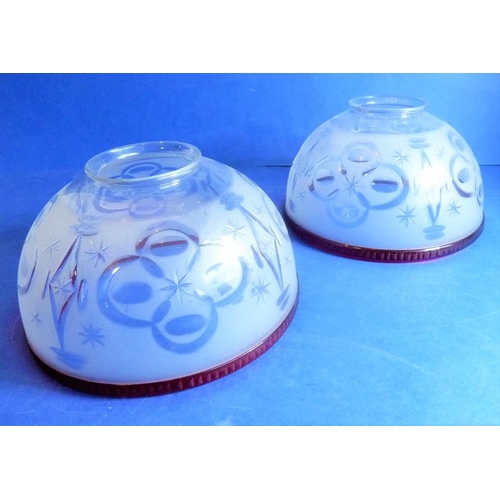 56 - A large and ornate 19th century two-branch gasolier with etched-glass shades having cranberry edges ... 