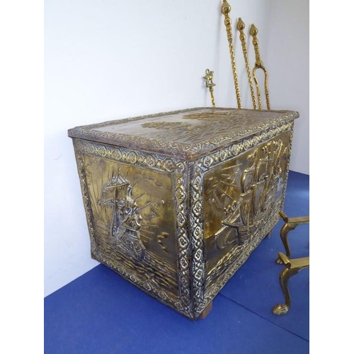 58 - Fireside brassware comprising a coal box, fire-irons and fire-dogs; the coal box decorated with gall... 