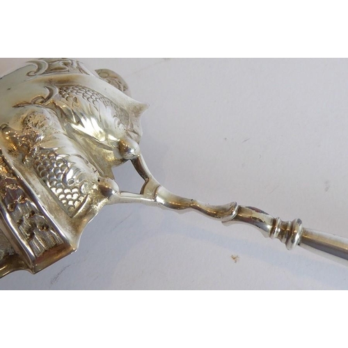 149 - A mid-18th century silver and fruitwood toddy ladle; the lobed bowl embossed with floral, fruiting, ... 