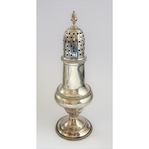 151 - An 18th century hallmarked silver baluster-shaped caster; having pierced domed cover, acorn-style fi... 