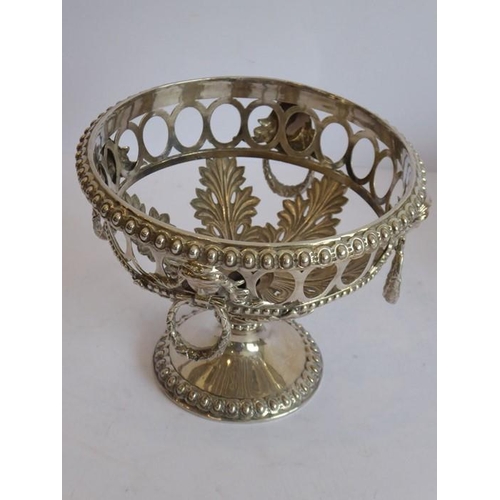 152 - A cut-glass bowl within an ornate silver-plated mount headed with four female mask and ring heads ab... 