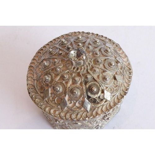 155 - A heavy cast circular silver metal coloured box and cover of Eastern inspiration (possibly Indian/Ir... 