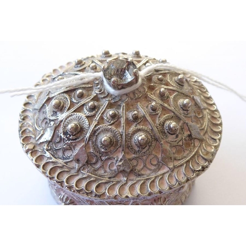 155 - A heavy cast circular silver metal coloured box and cover of Eastern inspiration (possibly Indian/Ir... 