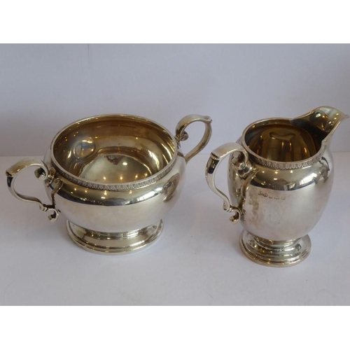 156 - A good and heavy hallmarked silver four-piece tea service comprising teapot, hot-water jug, two-hand... 