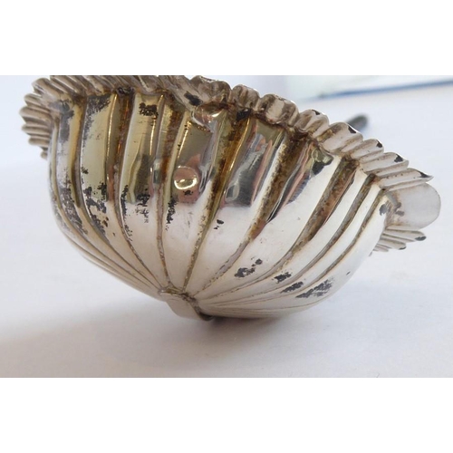 157 - An early 19th century silver and whalebone toddy ladle; the scallop-edged bowl to the monogrammed sh... 