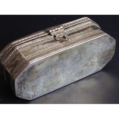 167 - A heavy Eastern white-metal box of octagonal form with straight sides; the top of the hinged lid set... 