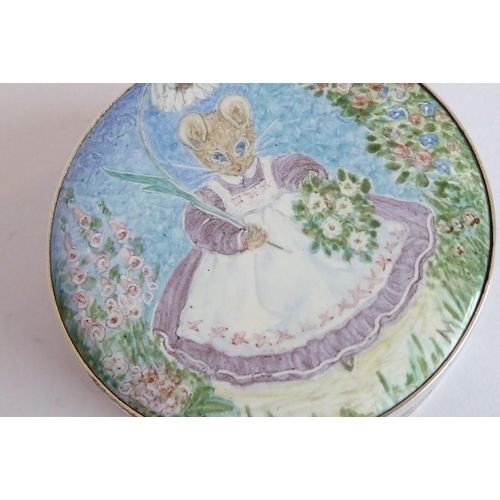 176 - A circular silver and enamel box; the enamel lid depicting Mrs Tittlemouse carrying a parasol and po... 