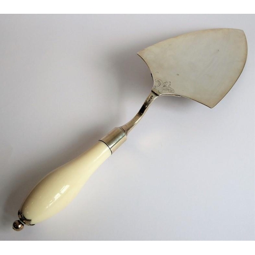 180 - A late 19th century silver and ivory-handled presentation trowel; the script within the foliate scro... 