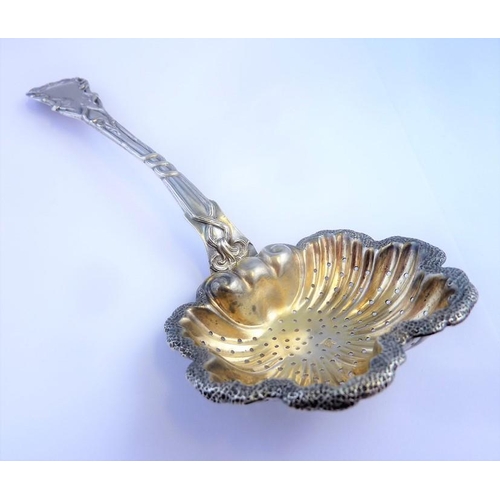 185 - A Russian silver tea strainer, dated 1854