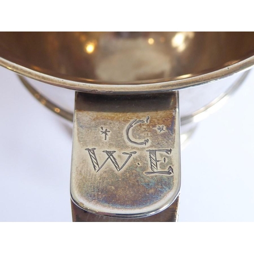 186 - A hallmarked silver two-handled loving cup; the handle terminals modelled as hearts, raised on sprea... 