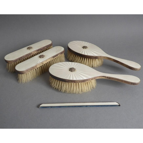 190 - A lady's silver and guilloche enamel dressing table set: two hairbrushes and two clothes brushes. To... 