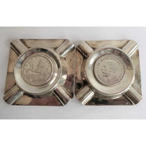 191 - A pair of hallmarked silver ashtrays of square form, each inset with a 1935 George V crown, maker's ... 