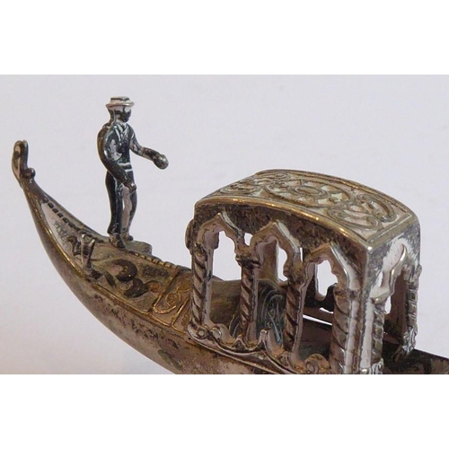 193 - An unusual heavy Continental silver model of a gondola on stand; the central canopy with arches and ... 