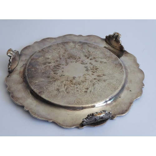 203A - A heavy early 19th century Sheffield plated salver (some wear); the border cast  with fruiting vine ... 