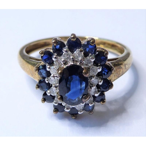 205 - A sapphire and diamond set cluster ring; the central oval mixed-cut sapphire above a surround of bri... 