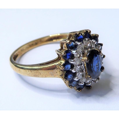 205 - A sapphire and diamond set cluster ring; the central oval mixed-cut sapphire above a surround of bri... 