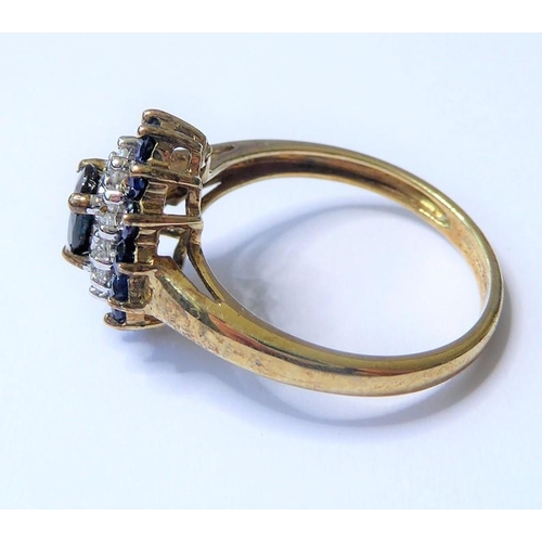 205 - A sapphire and diamond set cluster ring; the central oval mixed-cut sapphire above a surround of bri... 