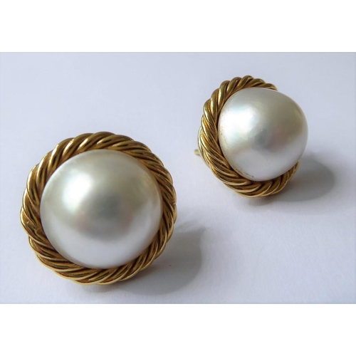 209 - A pair of mabé pearl and 18-carat yellow-gold ear clips each comprising a mabé pearl measuring 14mm ... 