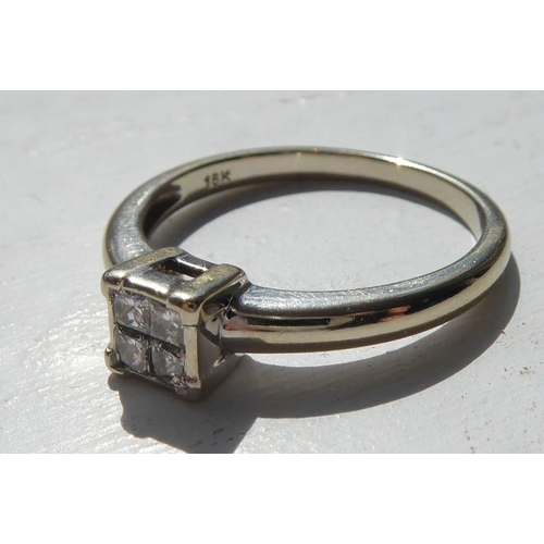 213 - A lady's fine 18 carat white gold dress ring; centrally-set with four diamonds within a square desig... 