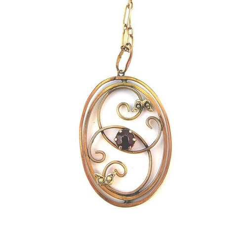 226 - A gold pendant set with a garnet and pearls on a Victorian rose-gold chain