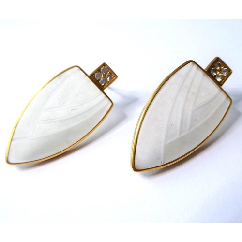 232 - A pair of frosted glass and diamond-set ear pendants, each designed as a moulded shield to the four ... 