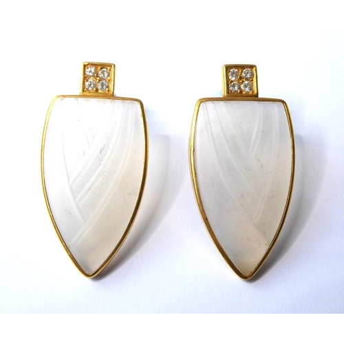 232 - A pair of frosted glass and diamond-set ear pendants, each designed as a moulded shield to the four ... 