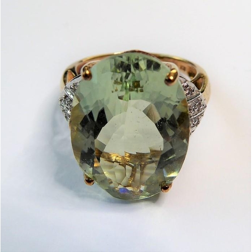 235 - A pale green (probably beryl) ring, the oval mixed-cut stone claw-set to the 9 carat yellow and whit... 