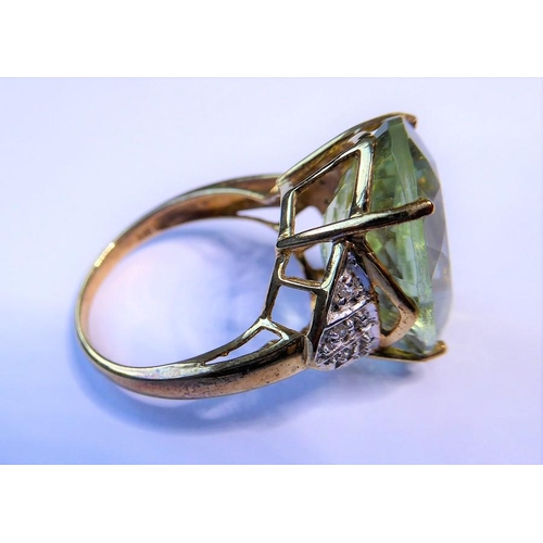 235 - A pale green (probably beryl) ring, the oval mixed-cut stone claw-set to the 9 carat yellow and whit... 