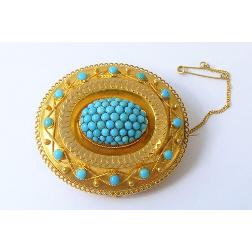 237 - A mid-19th century yellow gold and turquoise brooch, circa 1840, the central oval dome set with a ha... 