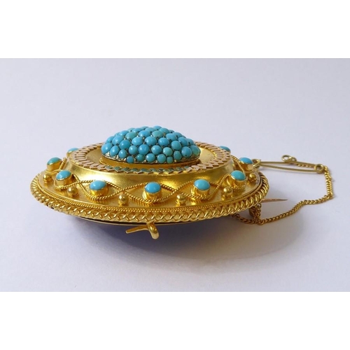 237 - A mid-19th century yellow gold and turquoise brooch, circa 1840, the central oval dome set with a ha... 