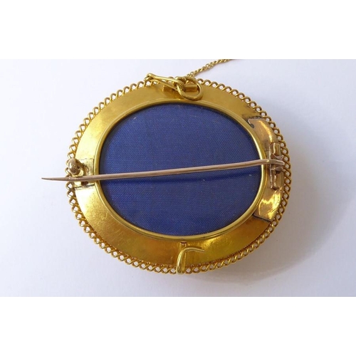 237 - A mid-19th century yellow gold and turquoise brooch, circa 1840, the central oval dome set with a ha... 