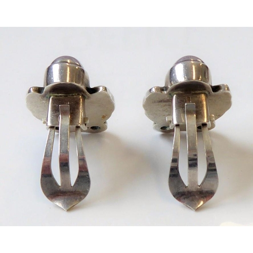 241 - A pair of Danish ear clips by Georg Jensen; of stylised tulip design, the reverse with maker's oval ... 