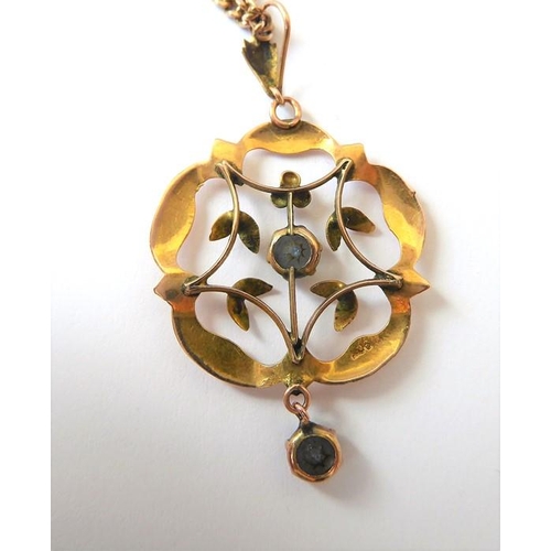 242 - A 9 carat yellow gold openwork cinquefoil pendant with a circular blue topaz centre and drop, stampe... 