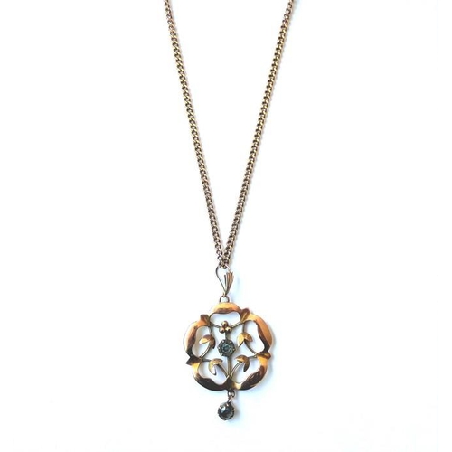 242 - A 9 carat yellow gold openwork cinquefoil pendant with a circular blue topaz centre and drop, stampe... 