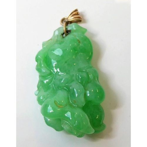 245 - Three Oriental inspired items ; a jadeite pendant (length 2.9mm, max. width 5.4mm, max. depth 6.4mm)... 