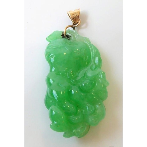 245 - Three Oriental inspired items ; a jadeite pendant (length 2.9mm, max. width 5.4mm, max. depth 6.4mm)... 