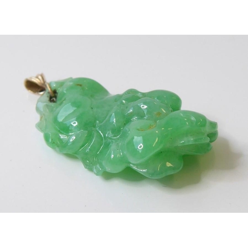 245 - Three Oriental inspired items ; a jadeite pendant (length 2.9mm, max. width 5.4mm, max. depth 6.4mm)... 