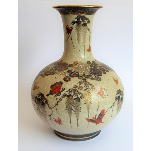 25 - An early 20th century Japanese Satsuma vase of bottle form; hand gilded and decorated with various b... 