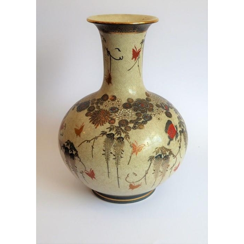 25 - An early 20th century Japanese Satsuma vase of bottle form; hand gilded and decorated with various b... 