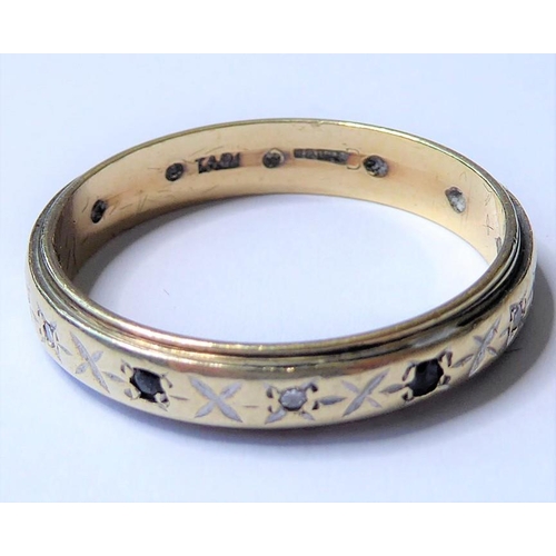 251 - A 9 carat yellow gold band ring, with engraved decoration and alternately set at intervals with circ... 