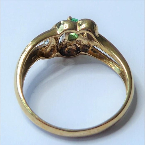 254 - An emerald and diamond-set ring, the pear-shaped emerald claw-set above an openwork setting with sin... 