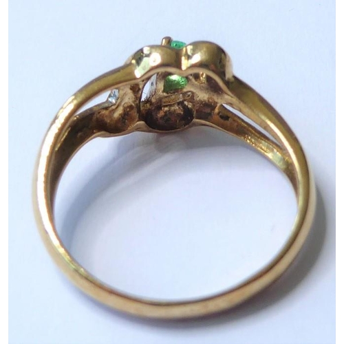 254 - An emerald and diamond-set ring, the pear-shaped emerald claw-set above an openwork setting with sin... 