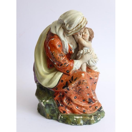 26 - A large early to mid-19th century hand-decorated Staffordshire-style porcelain figure; a seated moth... 