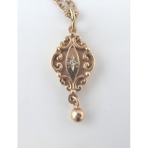 260 - A gold and diamond pendant with a 9-carat gold chain (weight 6.3g)