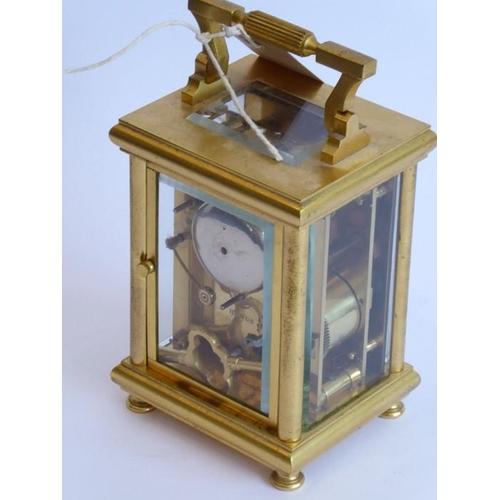 261 - A very fine 19th century gilt-metal-cased and glass-sided carriage clock; the swing carrying handle ... 