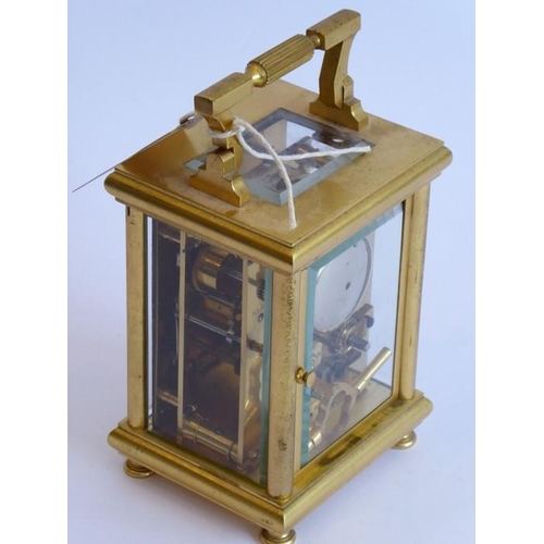 261 - A very fine 19th century gilt-metal-cased and glass-sided carriage clock; the swing carrying handle ... 