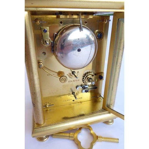 261 - A very fine 19th century gilt-metal-cased and glass-sided carriage clock; the swing carrying handle ... 