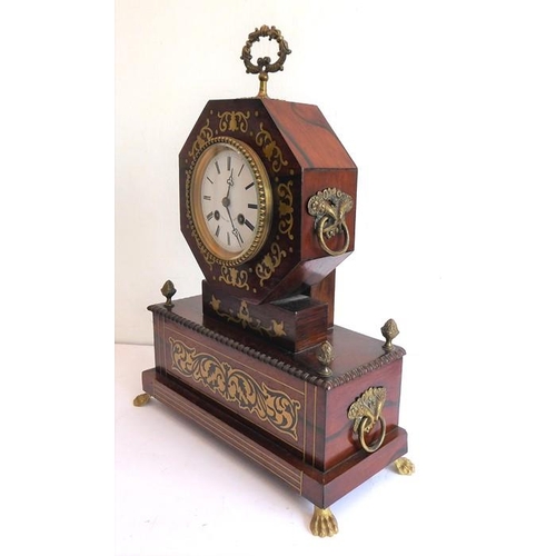 262 - An early 19th century rosewood and brass inlaid eight-day mantle clock; the white-enamel dial with R... 